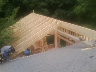 Framing a new roof addition that ties into an existing shingle roof in Moosup